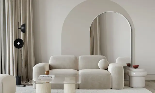 Nowoczesny salon z sofą i łukiem w tle. Inspiracje na aranżację z łukiem w salonie.